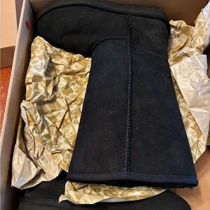 Classic tall black Ugg boots. Never worn in box